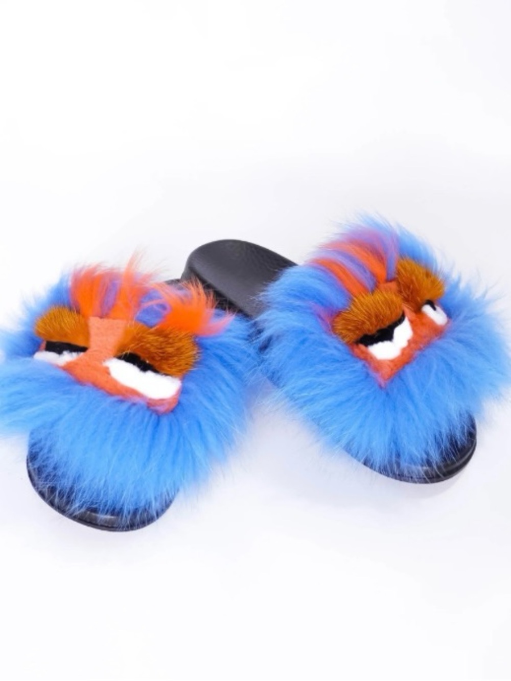 Fuzzy monster-faced slides are part of the Cape Robbin Mochi-Shi Fur collection